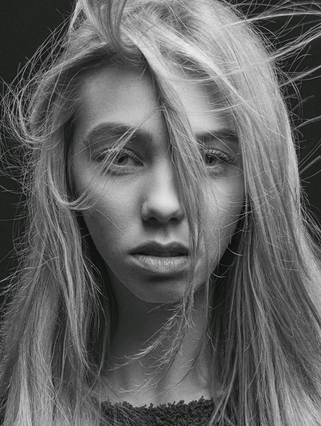 Studio portrait of a woman with long blonde hair
